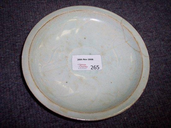 Appraisal: A Sung Ching p'ai ware saucer with flanged rim of