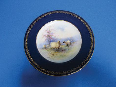 Appraisal: A ROYAL WORCESTER CABINET PLATE painted with sheep in a