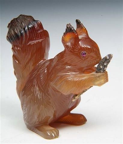 Appraisal: A HARDSTONE SQUIRREL bearing Faberge mark with ruby eyes and