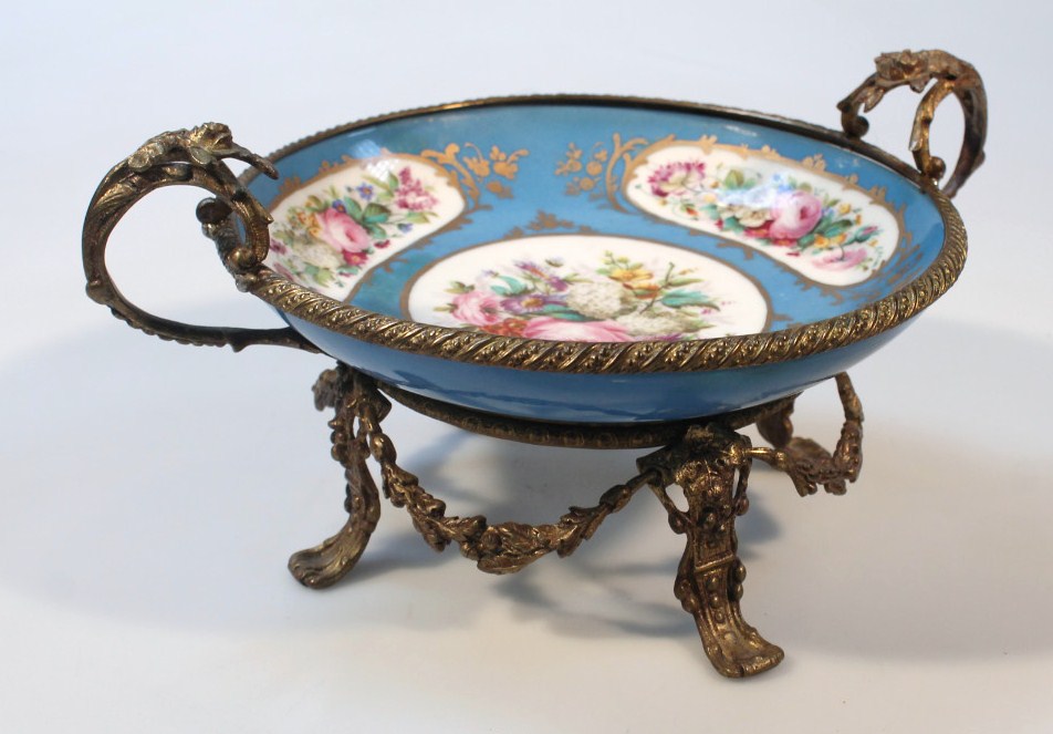 Appraisal: A Sevres style porcelain dish the circular body centred with