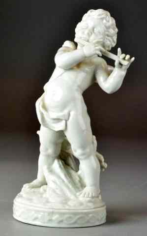 Appraisal: Spanish Porcelain Figure Of A Flute Playing CherubAn ivory colored