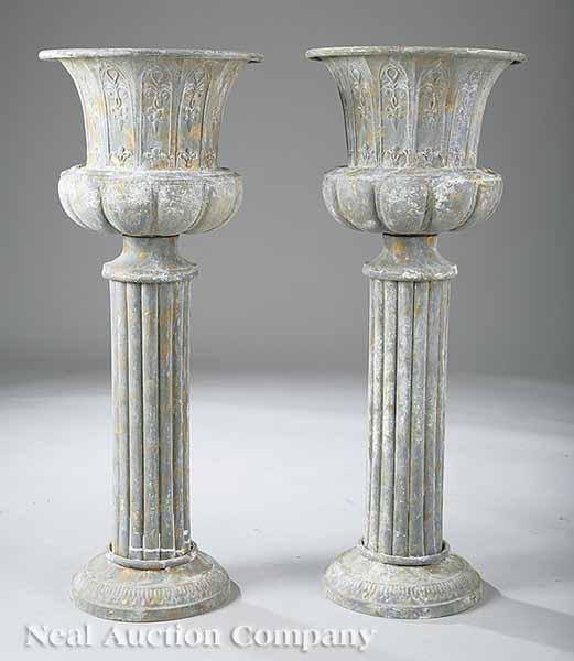 Appraisal: A Pair of Cast Iron and Zinc Urns with lobed