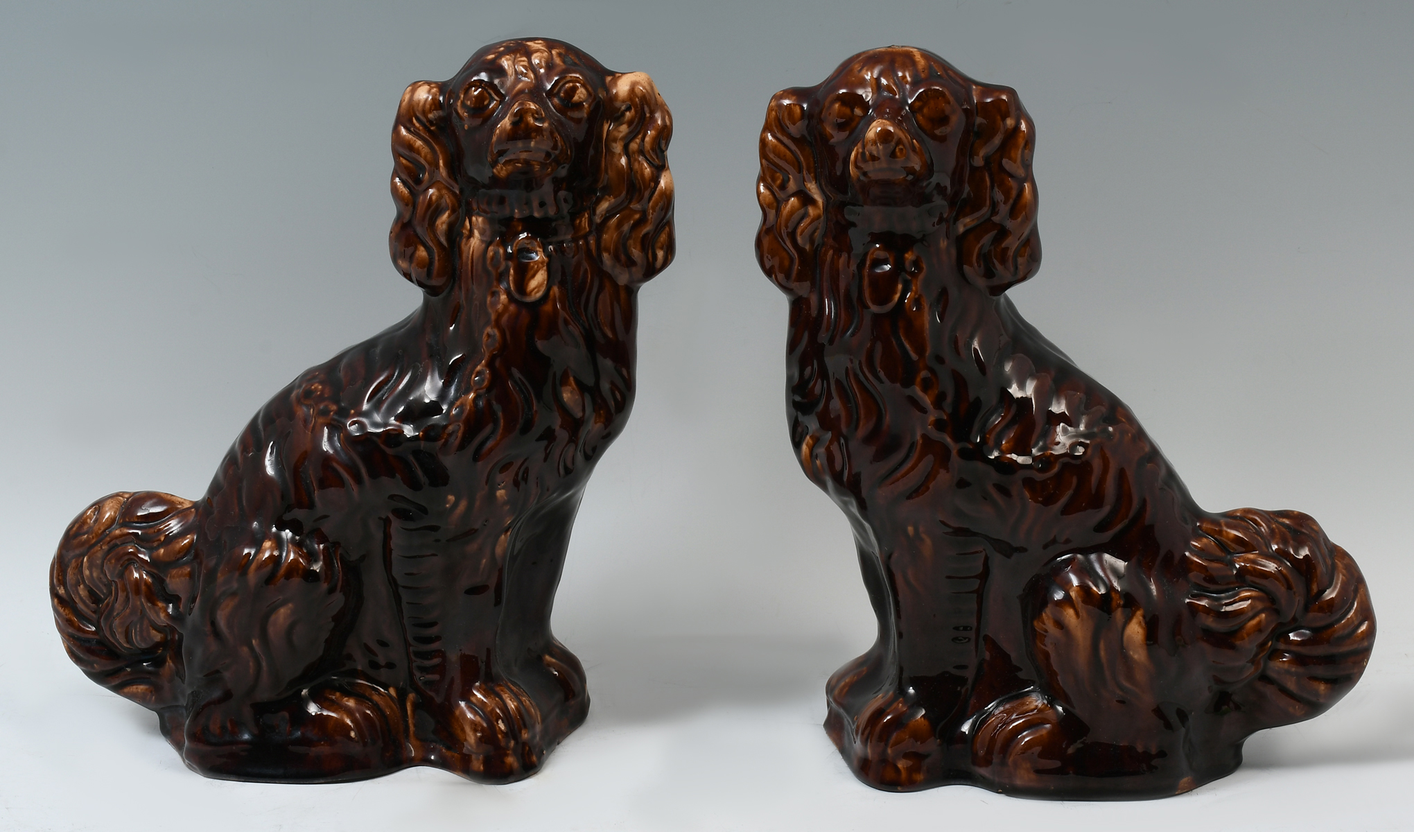 Appraisal: PAIR BENNINGTON POTTERY DOGS Pair of th century Bennington pottery