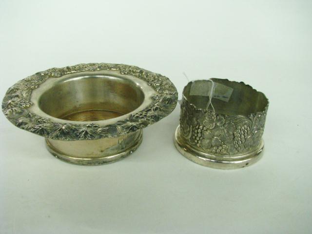 Appraisal: Two Decorative silver plated Wine Bottle Coasters both with grape