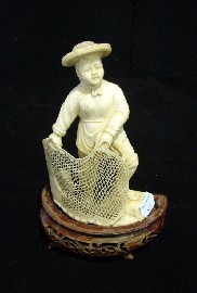 Appraisal: A Chinese figure of a young girl casting a fishing