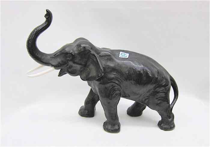 Appraisal: BRONZED SPELTER ELEPHANT SCULPTURE patinated dark brown with bone tusks