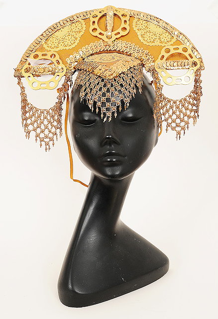 Appraisal: A gold coloured Chinese style headdress from the film Flash