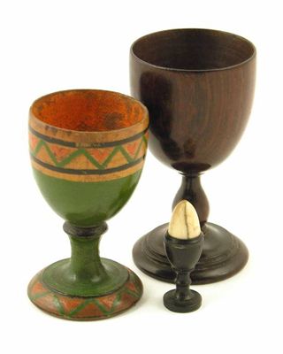 Appraisal: An early th century turned rosewood egg cup with a