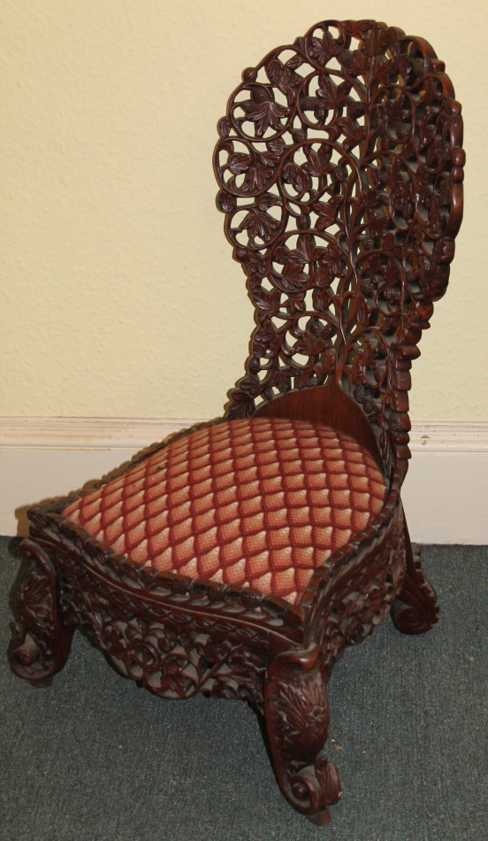 Appraisal: A thC Burmese hardwood spoon back side chair carved overall