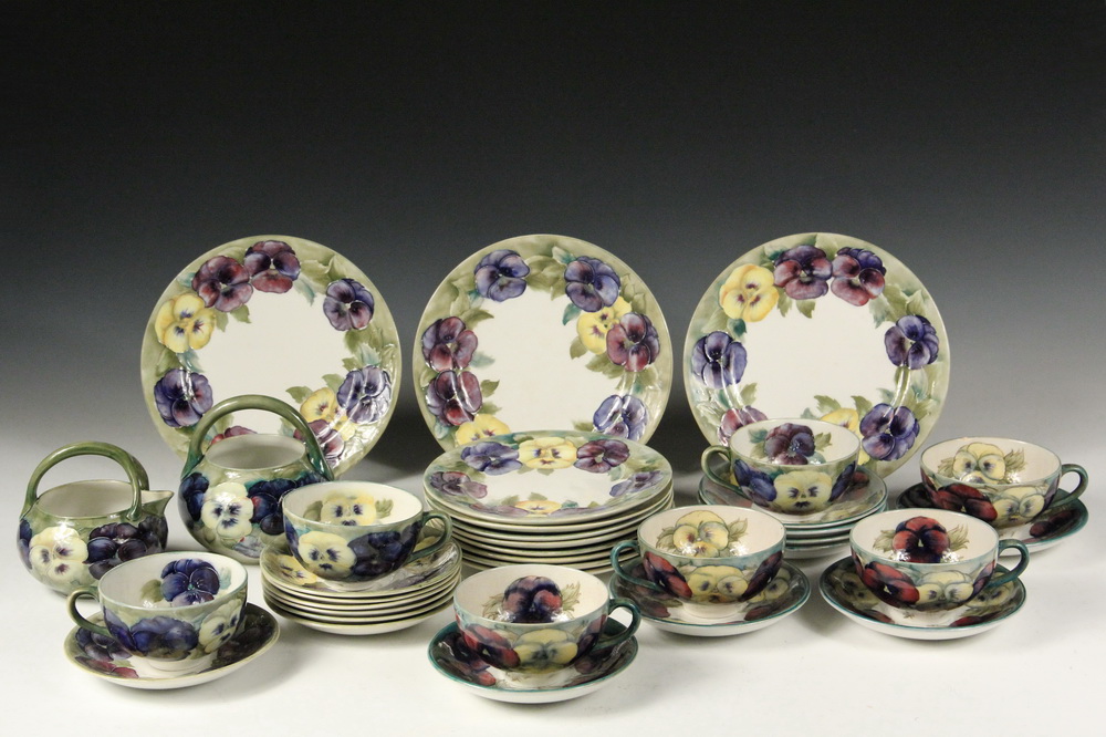 Appraisal: PCS MOORCROFT POTTERY - Partial Dessert Set in the Pansy