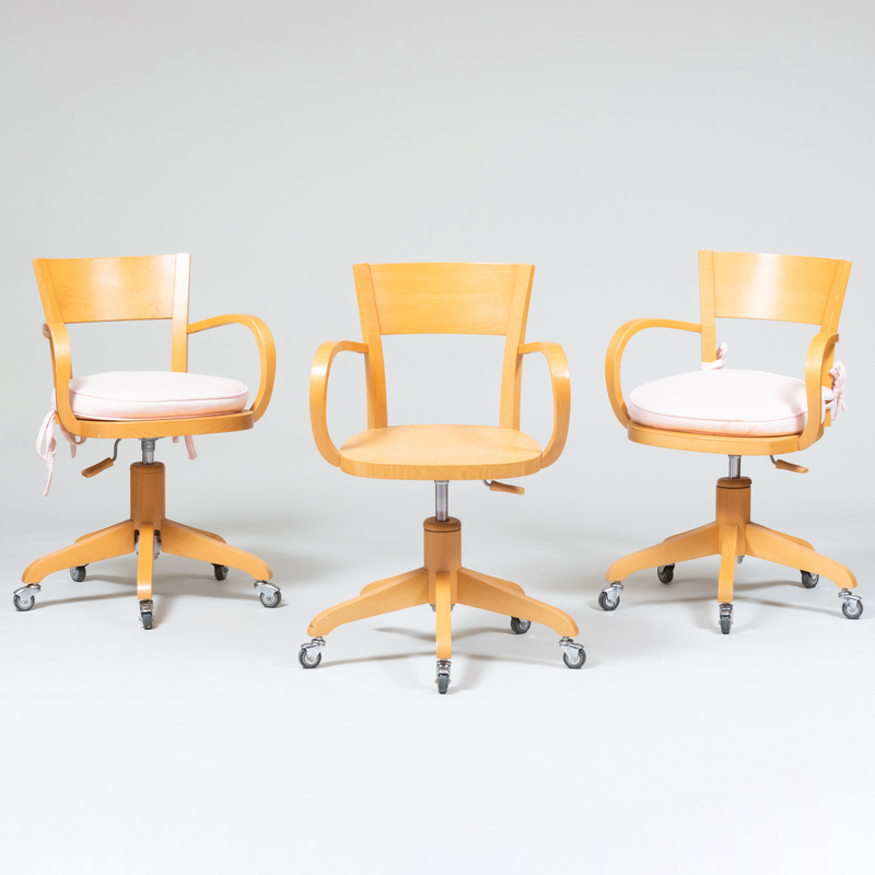 Appraisal: Three Contemporary Italian Blond Wood Swivel Arm Chairs by Calligaris