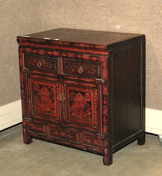 Appraisal: A Chinese mixed wood chest With two drawers above a