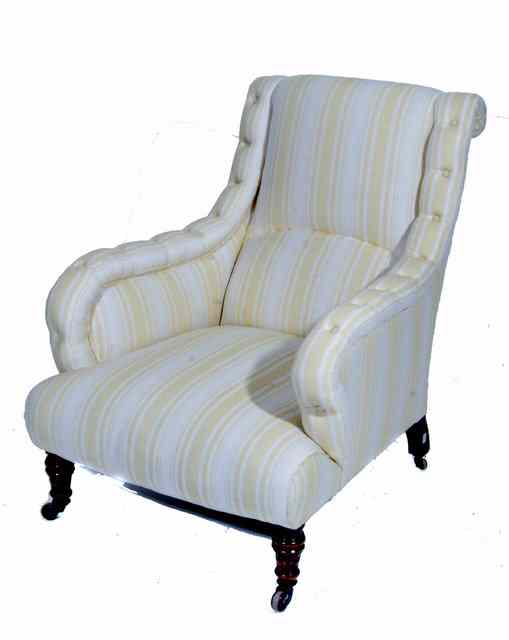 Appraisal: A VICTORIAN ARMCHAIR with yellow and white striped calico upholstery