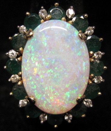 Appraisal: karat yellow gold opal emerald and diamond ringProng set cabochon