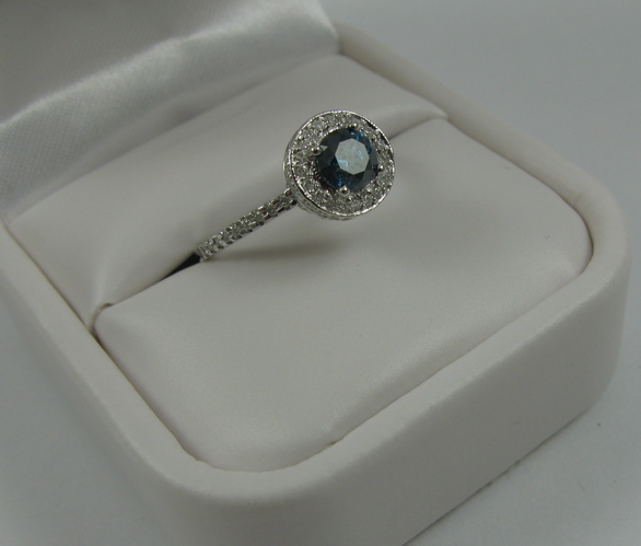 Appraisal: BLUE DIAMOND AND K WHITE GOLD RING WITH APPRAISAL centering