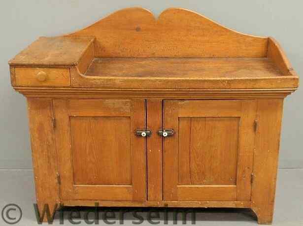 Appraisal: Unusual pine dry sink c with a scalloped backsplash and