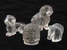 Appraisal: Four rock crystal carving being a sitting dog another a