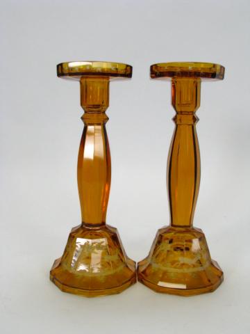 Appraisal: Pair of Amber cut to clear Bohemian glass candlesticks with