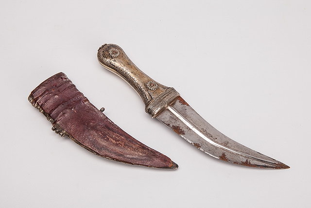 Appraisal: AN ANTIQUE MIDDLE EASTERN SILVER AND IVORY HANDLE DAGGER with