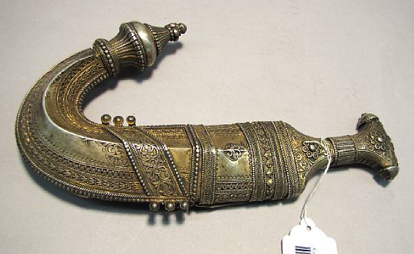 Appraisal: A silver-mounted Arabian jambiya th or early th century Curved