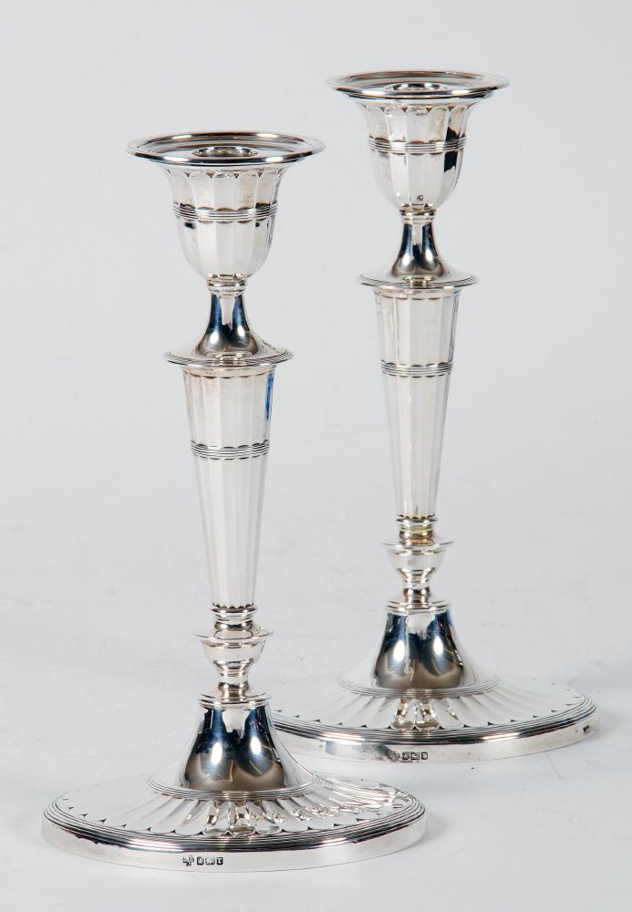 Appraisal: A PAIR OF EDWARDIAN CANDLESTICKS maker's mark HE Sheffield in