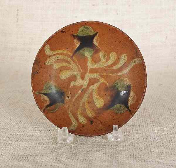 Appraisal: Pennsylvania redware tart plate th c with yellow green and