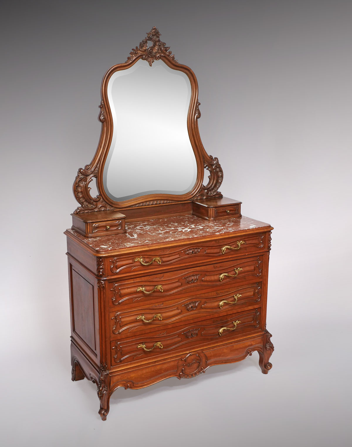 Appraisal: FRENCH VICTORIAN WALNUT MARBLE TOP DRESSER AND MIRROR Surmounting curvaceous