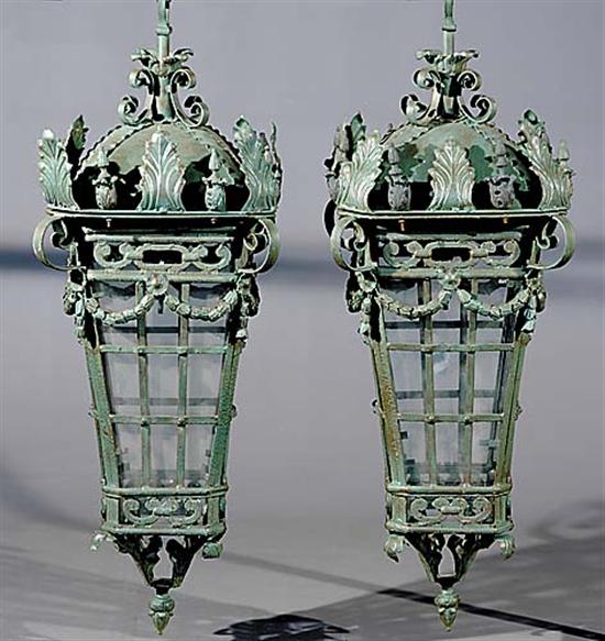 Appraisal: Pair cast-metal lanterns with brackets faceted lamps with leaf-form decoration