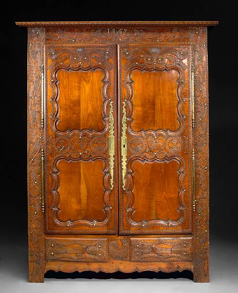 Appraisal: A French Provincial fruitwood armoire second quarter th century height