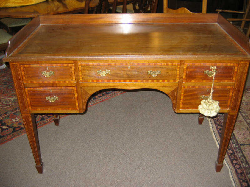 Appraisal: ENGLISH TH CENTURY MAHOGANY WRITING DESK Rectangular crossbanded top with