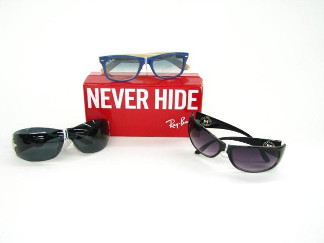 Appraisal: Lot of three sunglasses Prada unisex black shield sunglasses with