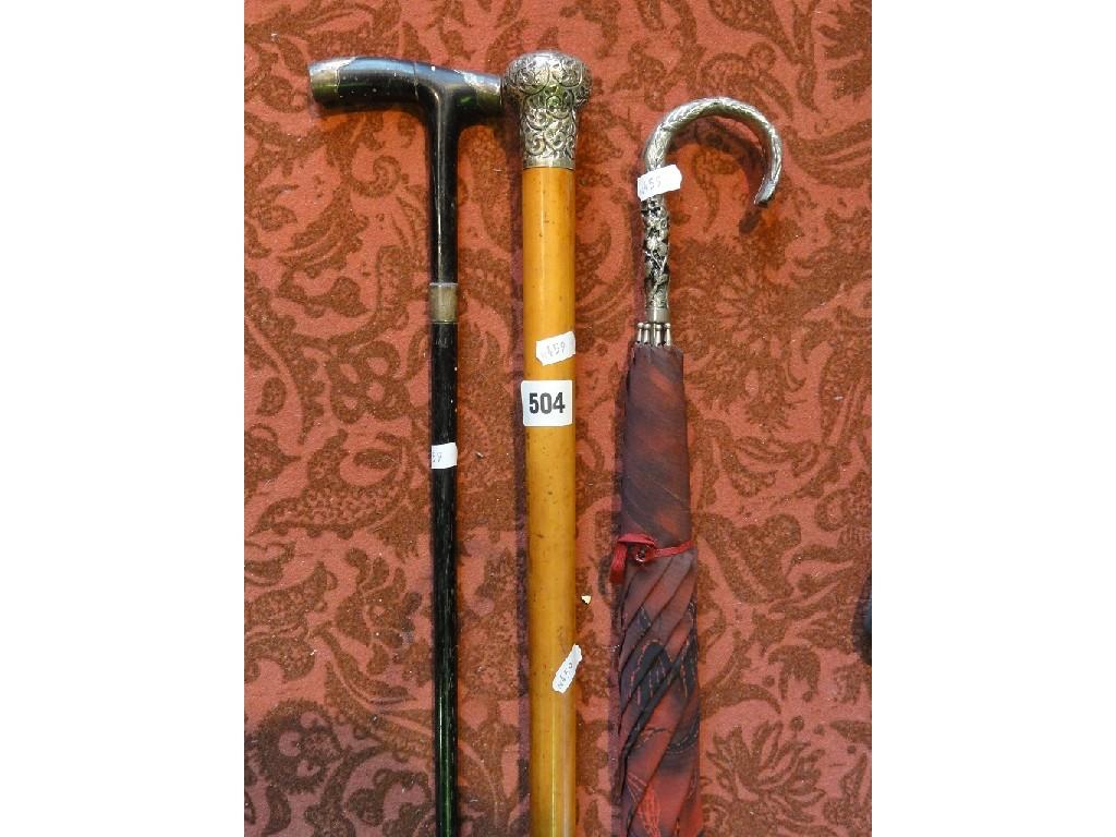 Appraisal: A gentleman's walking cane with an Indian silver incised knop