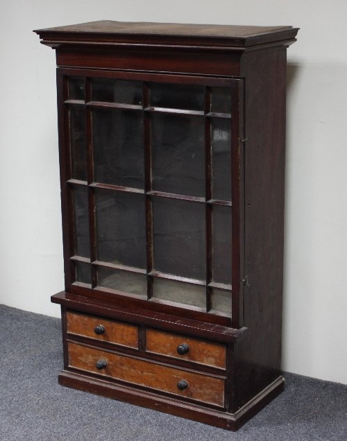 Appraisal: A small glass fronted cabinet with glazed upper part above