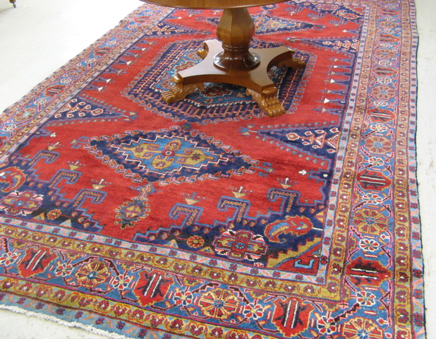 Appraisal: PERSIAN VISS CARPET northwestern Iran the plain red field decorated