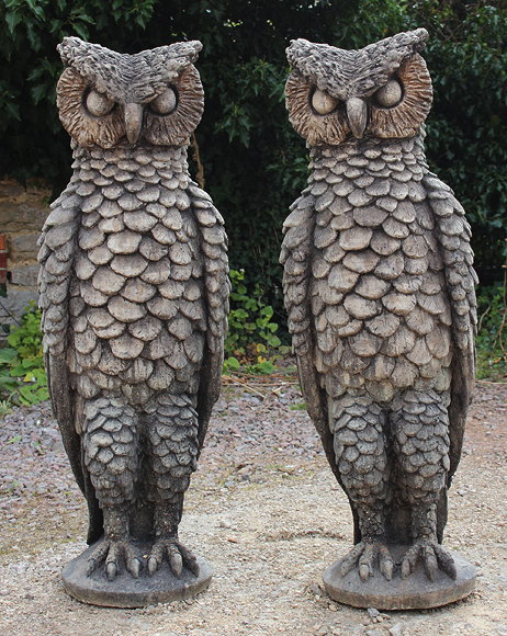 Appraisal: A PAIR OF LARGE CAST COMPOSITE STONE STANDING OWLS cm