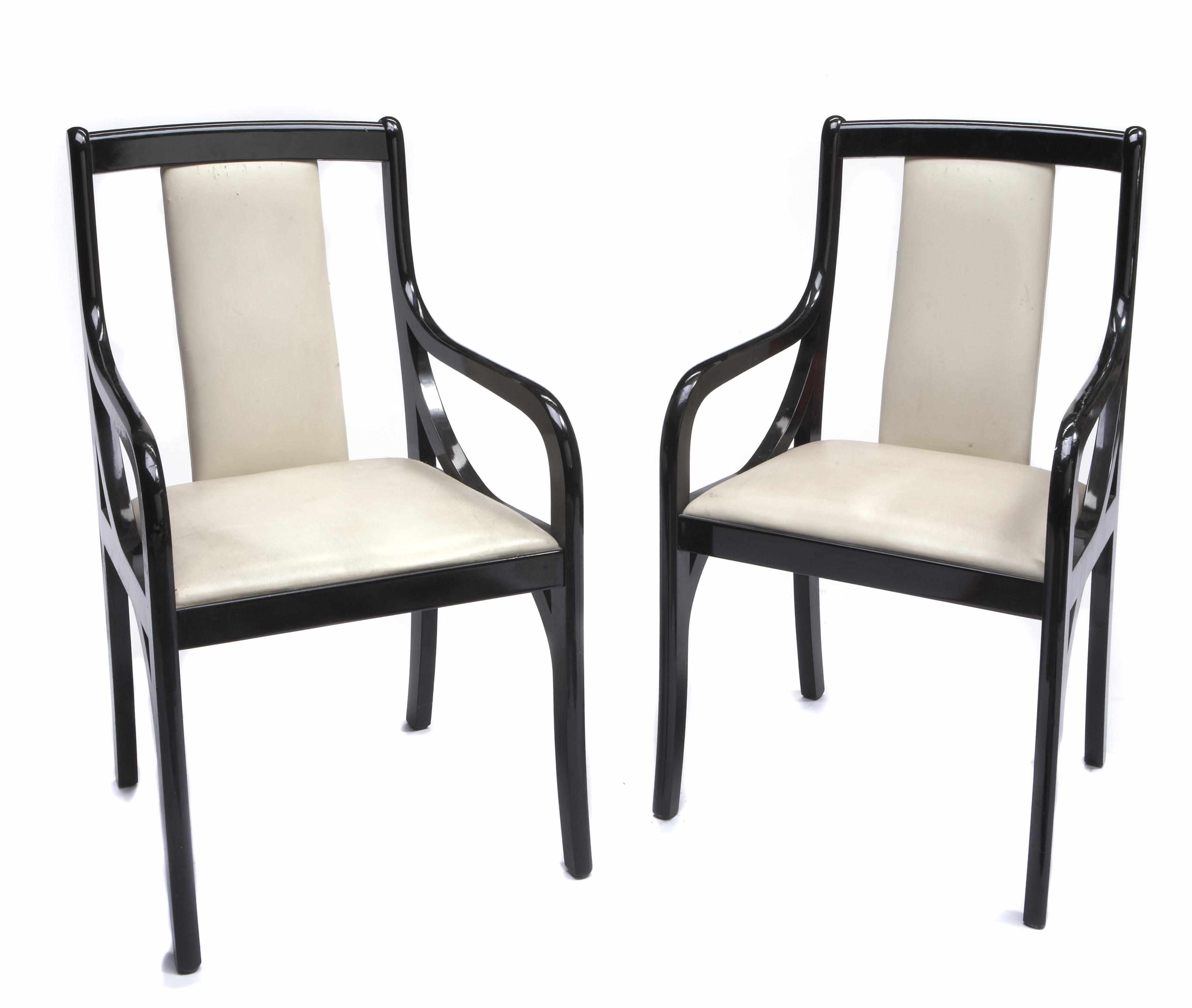 Appraisal: A pair of Neoclassical style ebonized armchairs height in width