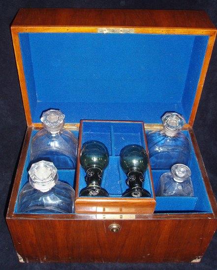 Appraisal: A Victorian walnut decanter box fitted a tray and compartments