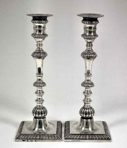 Appraisal: A pair of late Victorian silver pillar candlesticks of th