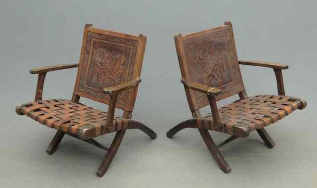 Appraisal: Pair folding Mid Century Danish chairs with leather strap seats