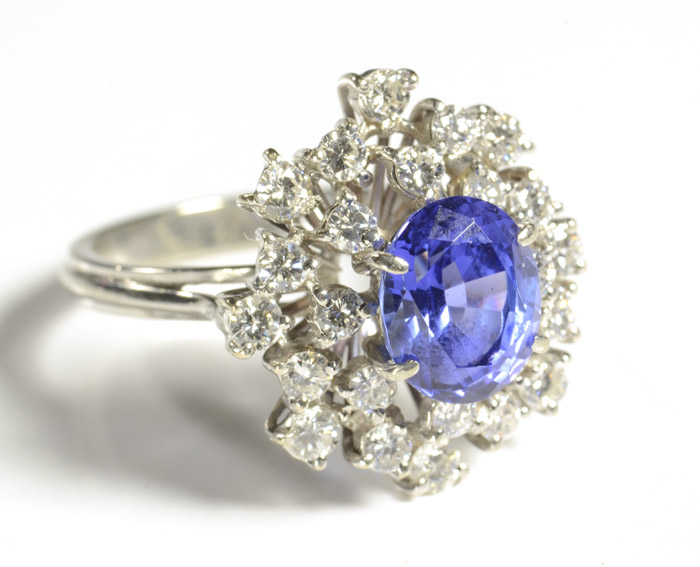 Appraisal: SAPPHIRE DIAMOND AND EIGHTEEN KARAT WHITE GOLD FASHION RING centering