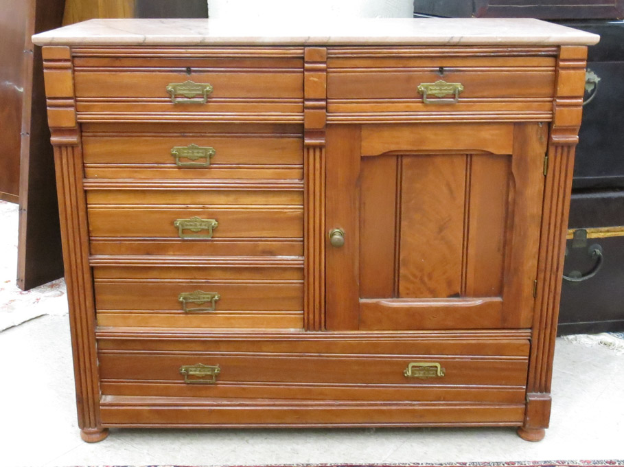 Appraisal: VICTORIAN MARBLE-TOP WALNUT BUFFET Eastlake design American c having a