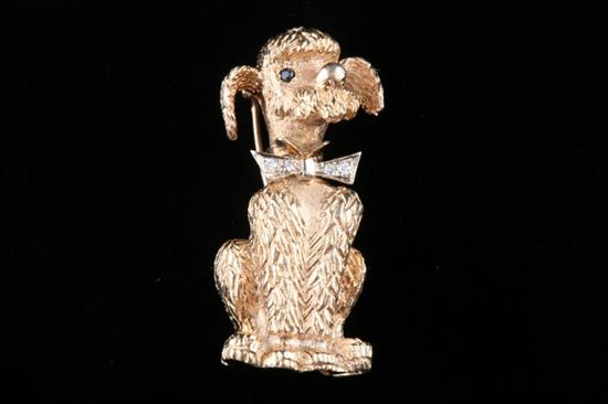 Appraisal: K YELLOW GOLD AND DIAMOND WHIMSICAL POODLE BROOCH Seated poodle