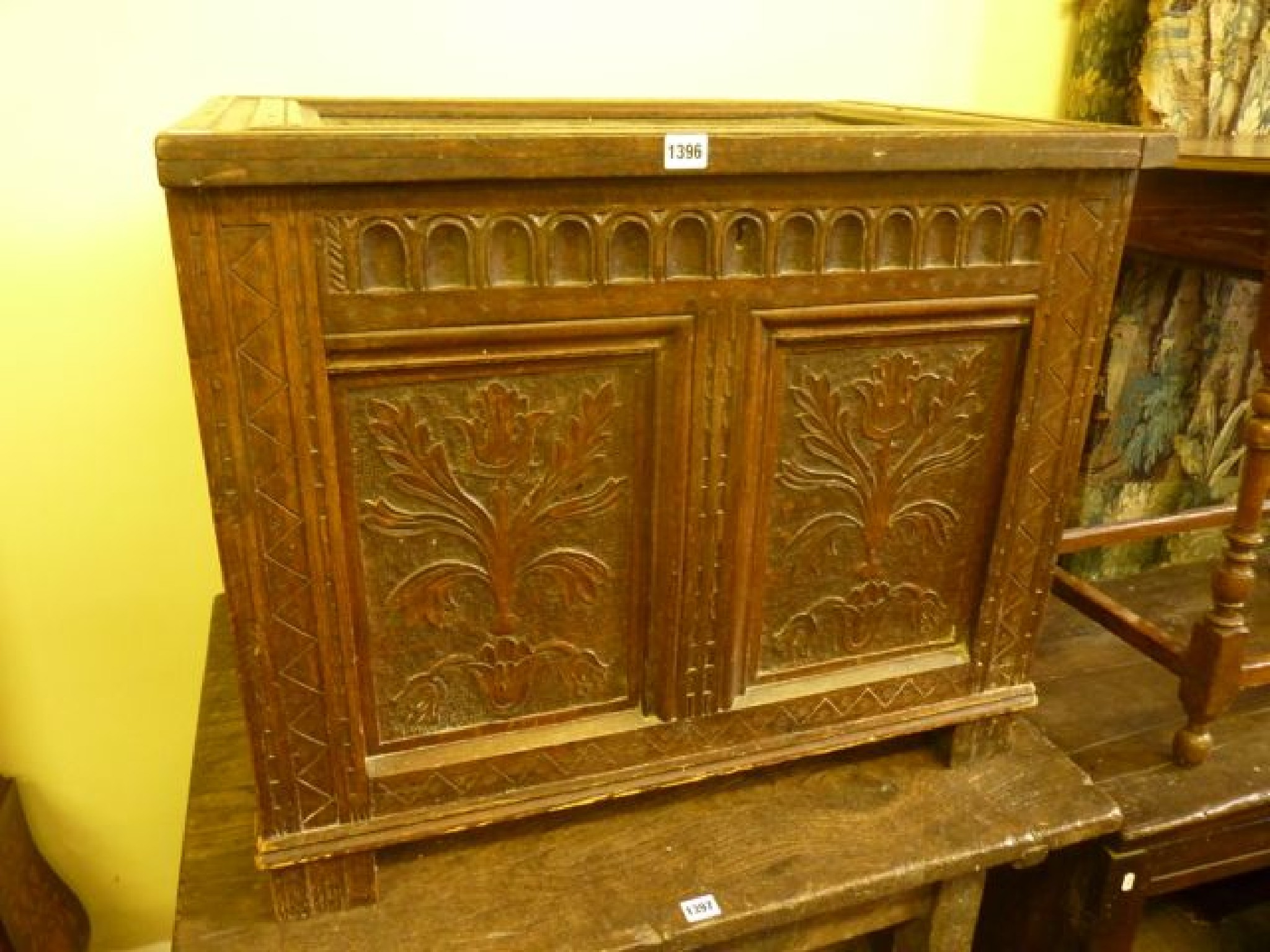 Appraisal: An antique oak coffer with hinged lid and panelled frame