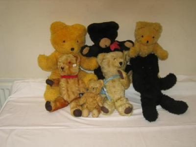 Appraisal: Four various unjointed teddy bears two in gold plush one