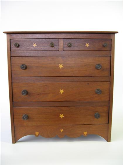 Appraisal: Walnut child's chest of drawers with satinwood star inlay berks