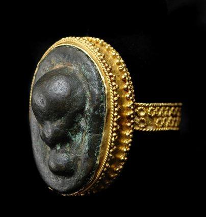 Appraisal: Persian Glass Set in a Granulated Gold Ring