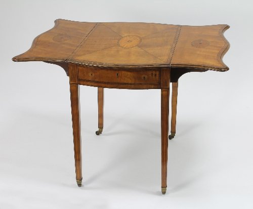 Appraisal: A George III satinwood serpentine leafed Pembroke table the segmented