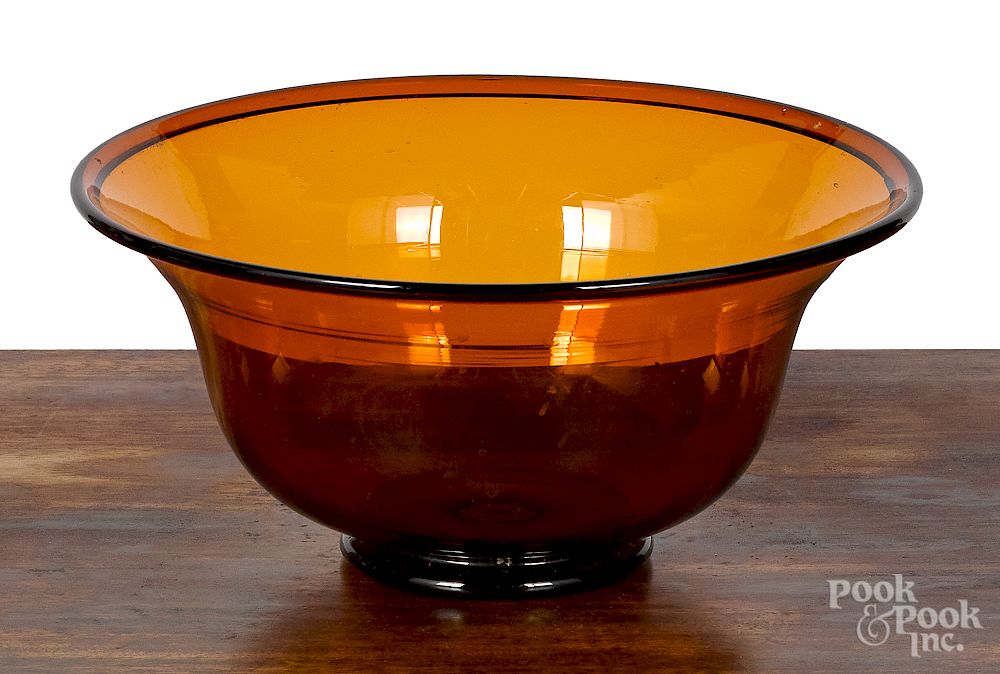 Appraisal: American blown amber glass footed bowl th c American blown