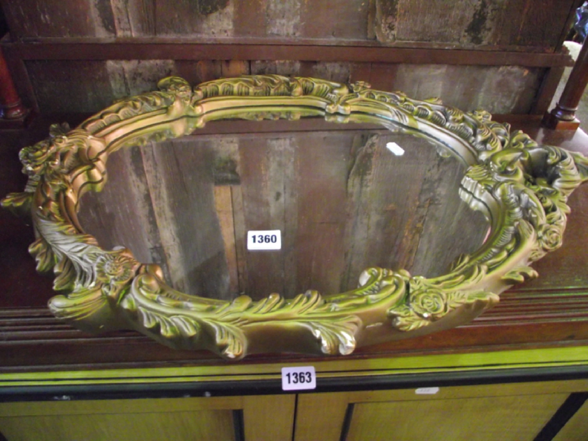 Appraisal: A carved and gilded wall mirror in the Rococo style