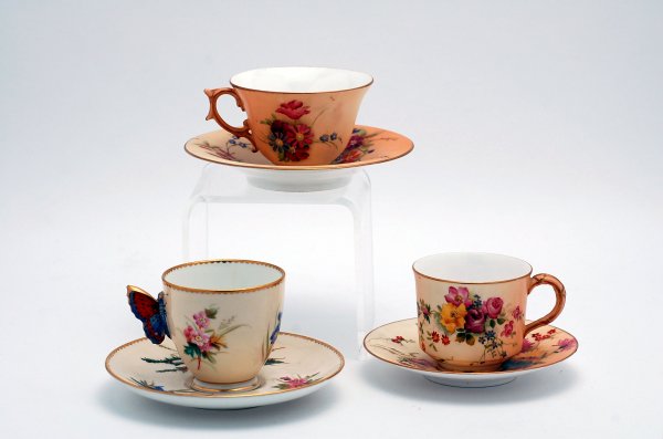 Appraisal: Three Royal Worcester cups and saucers two having floral decoration